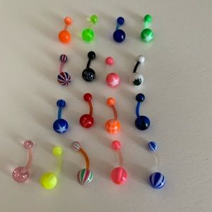 17 flexible belly rings! NEVER WORN
